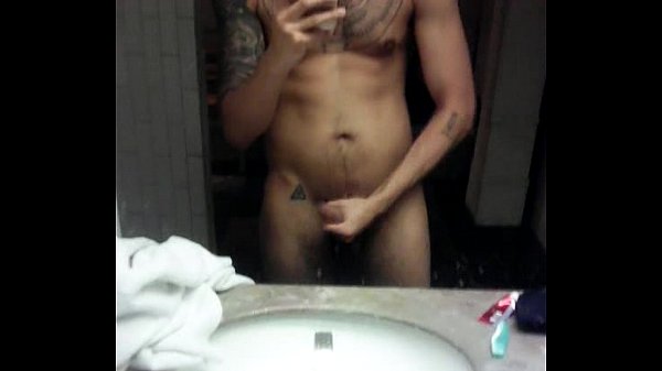 tattooed man jerking off